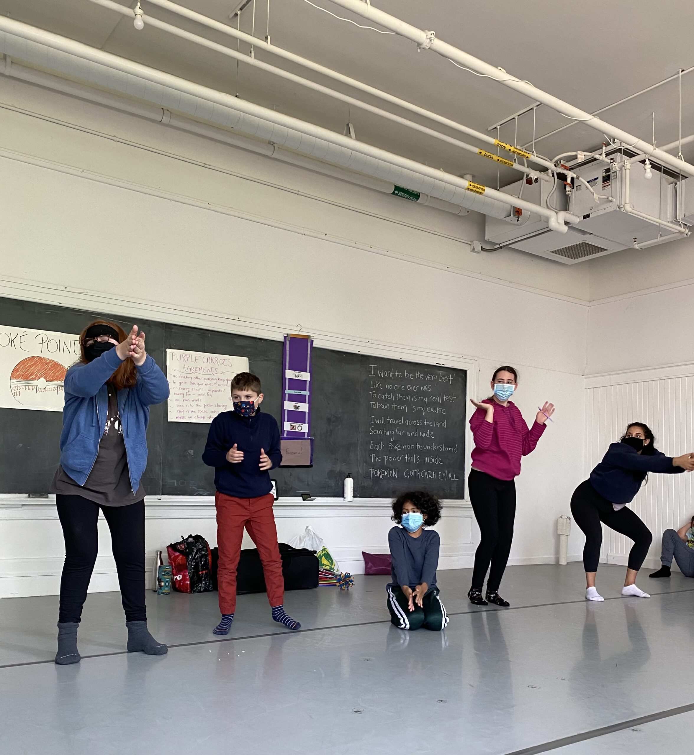 a group of people standing on top of a floor