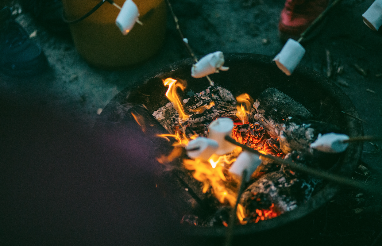 marshmallows roasting over an open fire