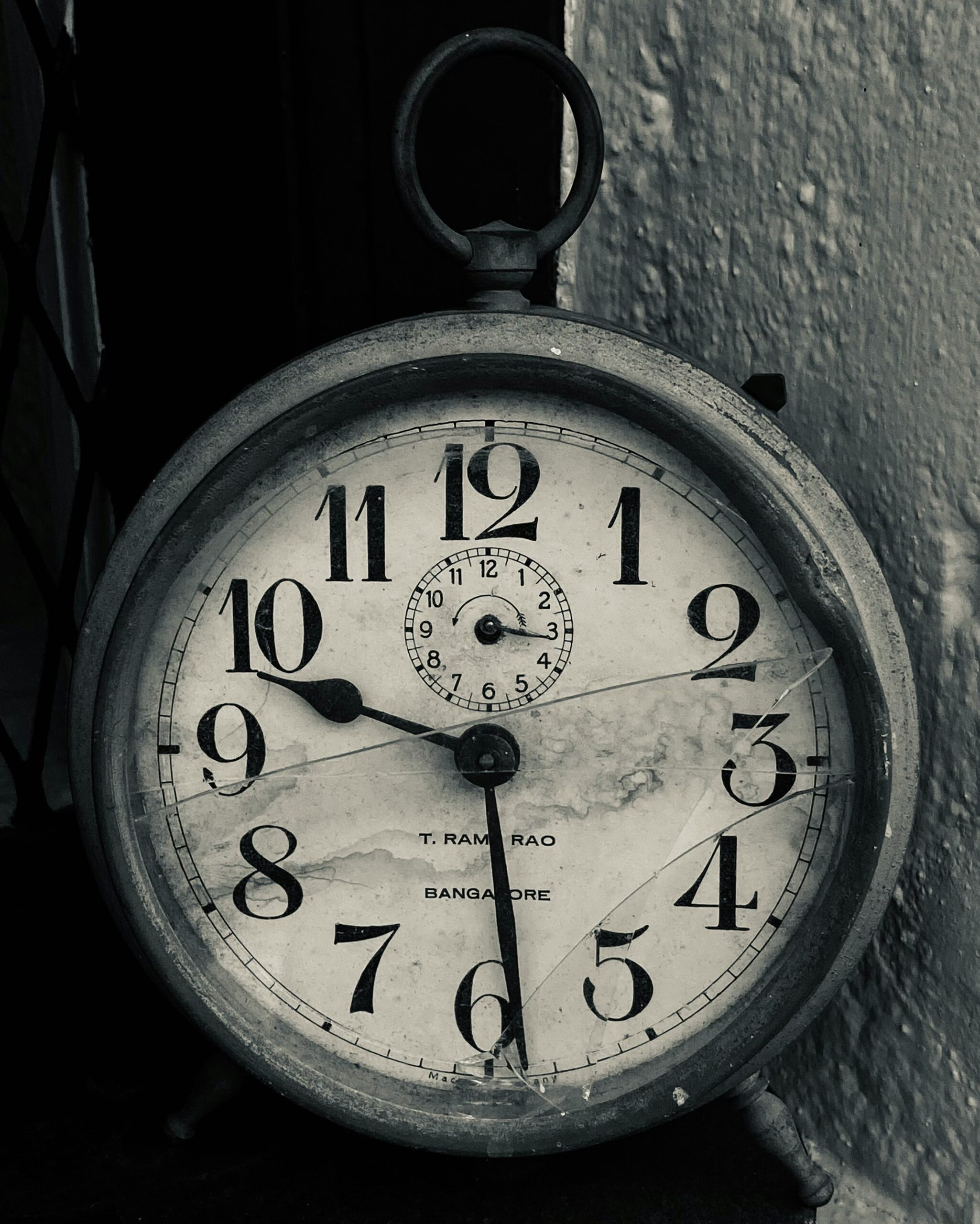 a black and white photo of an alarm clock